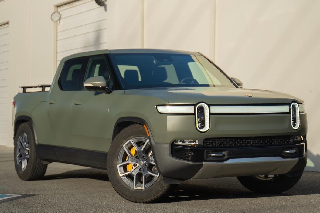 front and side of a green rivian r1t truck with paint protection film